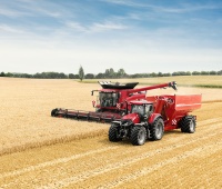Optum_300_CVX_with_unloading_trailer_and_Axial-Flow_01.jpg