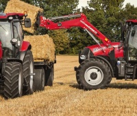 Case_IH_Maxxum_125_with_trailer_and_Maxxum_145_CVX_with_LRZ120_Loader.jpg